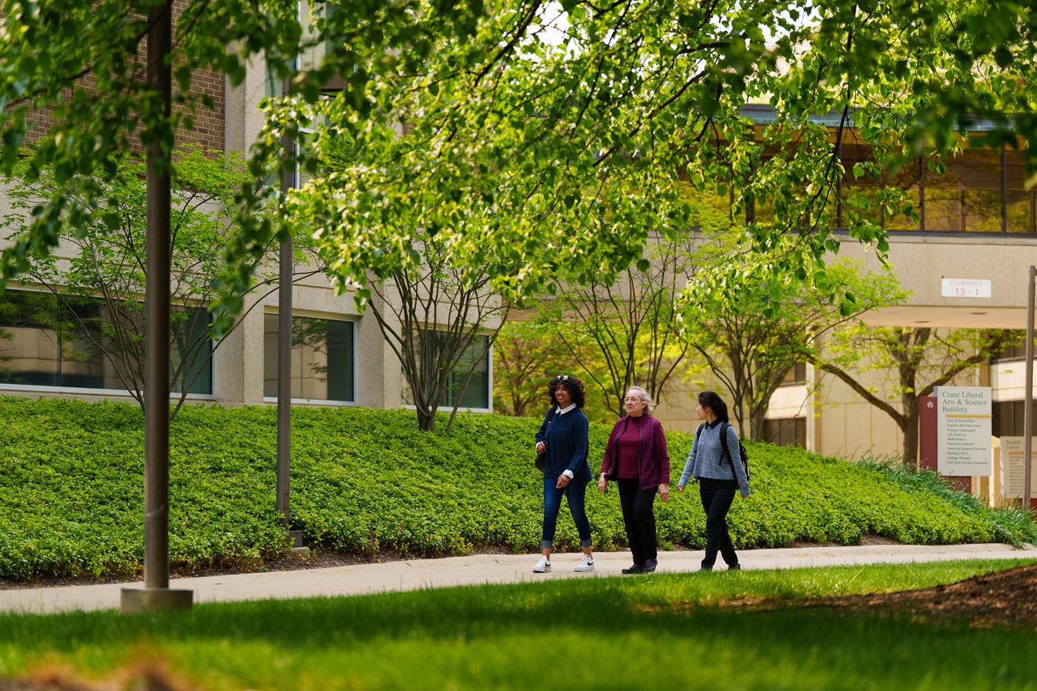 Students walk through the Washtenaw Community College campus.